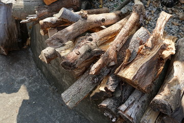 Fototapeta na wymiar The dried and chopped firewood pile at outdoor.