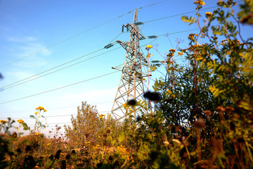 Mast of high voltage power line against sky