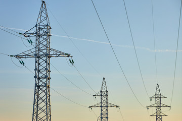 Mast of high voltage power line against sky