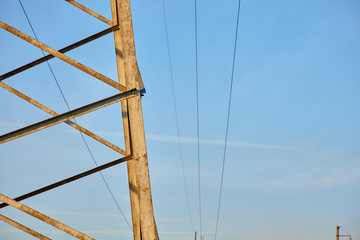 Mast of high voltage power line against sky