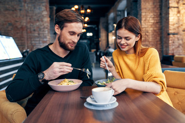 young couple having dinner in restaurant