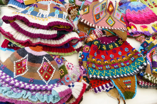 Handicraft souvenirs from Peru: colorful woolen knitted hats  with tradition design at the Indian market in Lima, Peru