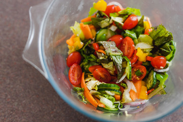 salad bowl with greens tomatoes capsicums and mixed veggies