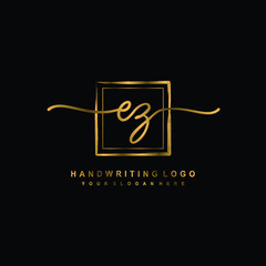 Initial E Z handwriting logo design, with brush box lines gold color. handwritten logo for fashion, team, wedding, luxury logo.