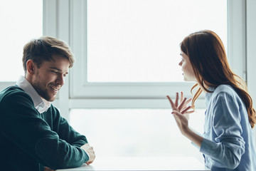 man and woman looking at screen