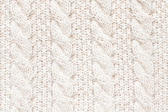 Cable knitting stitch pattern, soft woolen texture, handmade knitted cloth