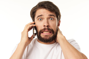 Fototapeta premium young man talking on the phone isolated on white