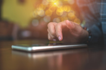 Woman hand using smartphone in cafe shop background. Business, financial, trade stock maket and social network.