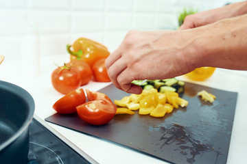 woman cutting vegetables in the kitchen