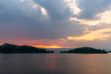 Obraz premium beautiful blue sky green forest mountains lake view at Kaeng Krachan National Park, Thailand. an idea for backpacker hiking on long weekend or a couple, family activity camping holiday relaxing