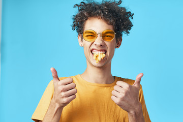 portrait of young woman with thumbs up