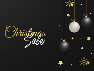 Fototapeta na wymiar Christmas Sale Poster Design Decorated with Hanging Baubles, Golden Stars and Snowflakes on Black Background.