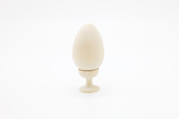 Decorative chicken eggs made of natural wood made by hand.The concept of the Christian Easter tradition is to creatively decorate and color artistically a bunch of eggs for a gift.