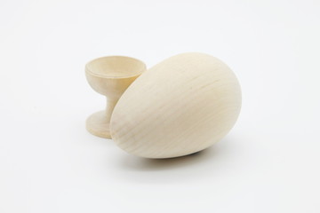 Decorative chicken eggs made of natural wood made by hand.The concept of the Christian Easter tradition is to creatively decorate and color artistically a bunch of eggs for a gift.