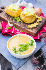 Peas soup. Hot yellow creamy homemade soup with peas and green onion sprouts on winter Christmas or Xmas background. Vegan and vegetarian food. 