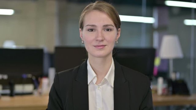 Portrait of Young Businesswoman Looking at the Camera 