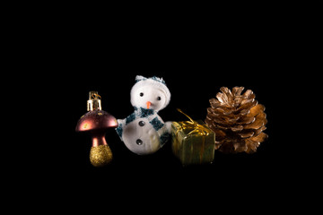  Snowman, mushroom, Christmas gift and pine cone, on a black background