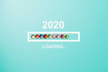 Fototapeta premium progress bar showing loading of 2020 with rhinestones on blue background