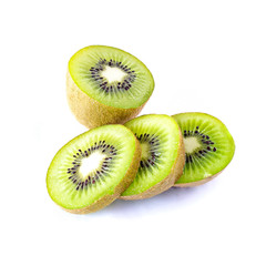 Multiple sliced kiwi fruit on a white background.