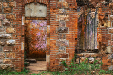 old brick and stone wall with doorway
