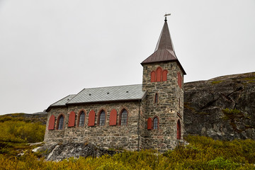 Obraz premium Stone Church in the mountains in the evening outdoors in summer, spring or autumn