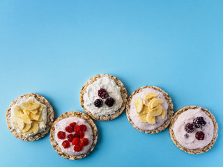 Crispbread with sweet filling and place for text on blue background