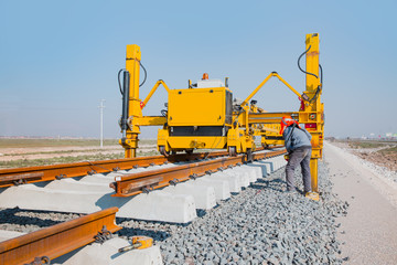 Metro (train) construction site, railroad track installation machine is in use