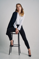 young businesswoman sitting on a chair