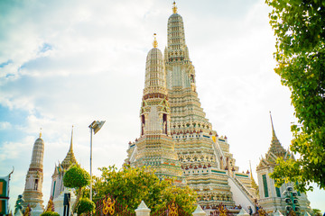 Fototapeta premium Wat arun ratchawararam buddhist temple against blue sky with cloud