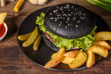 Tasty grilled homemade burger with beef, tomato, cheese, cucumber and lettuce