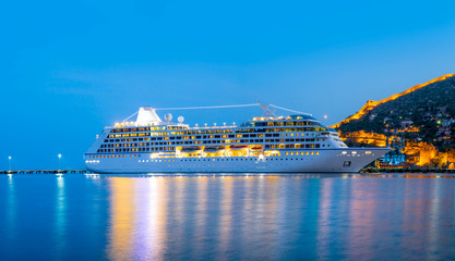 Beautiful white giant luxury cruise ship on stay at Alanya harbor - obrazy, fototapety, plakaty