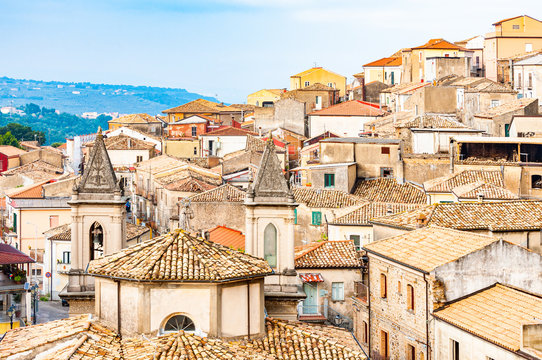 Traditional Italian village scenery. Cityscape of Curinga in Calabria, Italy. Medieval cityscape skyline of small southern Italian city located on evergreen forest mountains