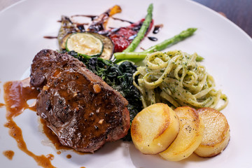 Grilled beef steak eat with several  side dish