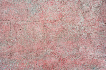 Texture of a concrete wall with cracks and scratches which can be used as a background
