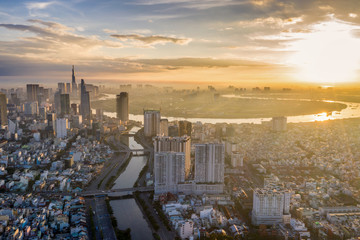 Amazing aerial view of Saigon cityscape under sunset sky 