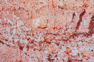 Texture of a concrete wall with cracks and scratches which can be used as a background