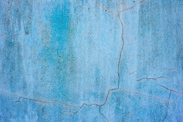Texture of a concrete wall with cracks and scratches which can be used as a background
