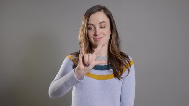 woman sign language saying I love you