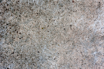 Texture of a concrete wall with cracks and scratches which can be used as a background