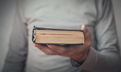 Caucasian man holding bible. Religion