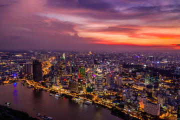Fototapeta na wymiar Saigon beautiful cityscape and lights with orange sunset skyline 