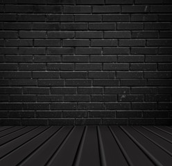 Black brick wall. Gloomy abstract background for design. The texture of the brick surface.