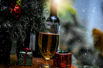 Wine bottle and glasses.with Christmas tree and gift box.