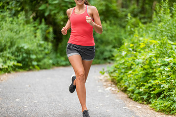 Running woman jogging in park. Healthy active lifestyle.