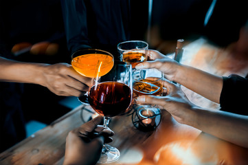 Cheers clinking of friends in party