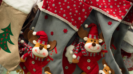 New Year's mittens hang on a fireplace