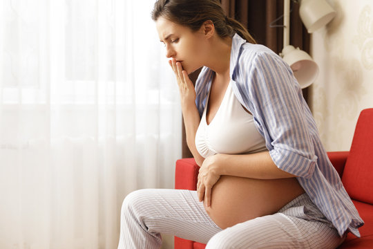 Pregnant woman at home feels sick
