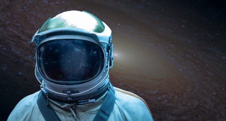 Astronaut in a front of stars in outer space. Conquest of Space Concept, Elements of this image...