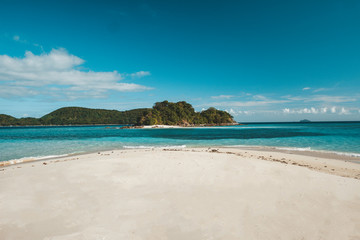 Philippines El nido , Palawan white sand beach without people, blue sky , turquoise water.