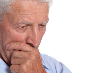 Close up portrait of sad senior man isolated on white background